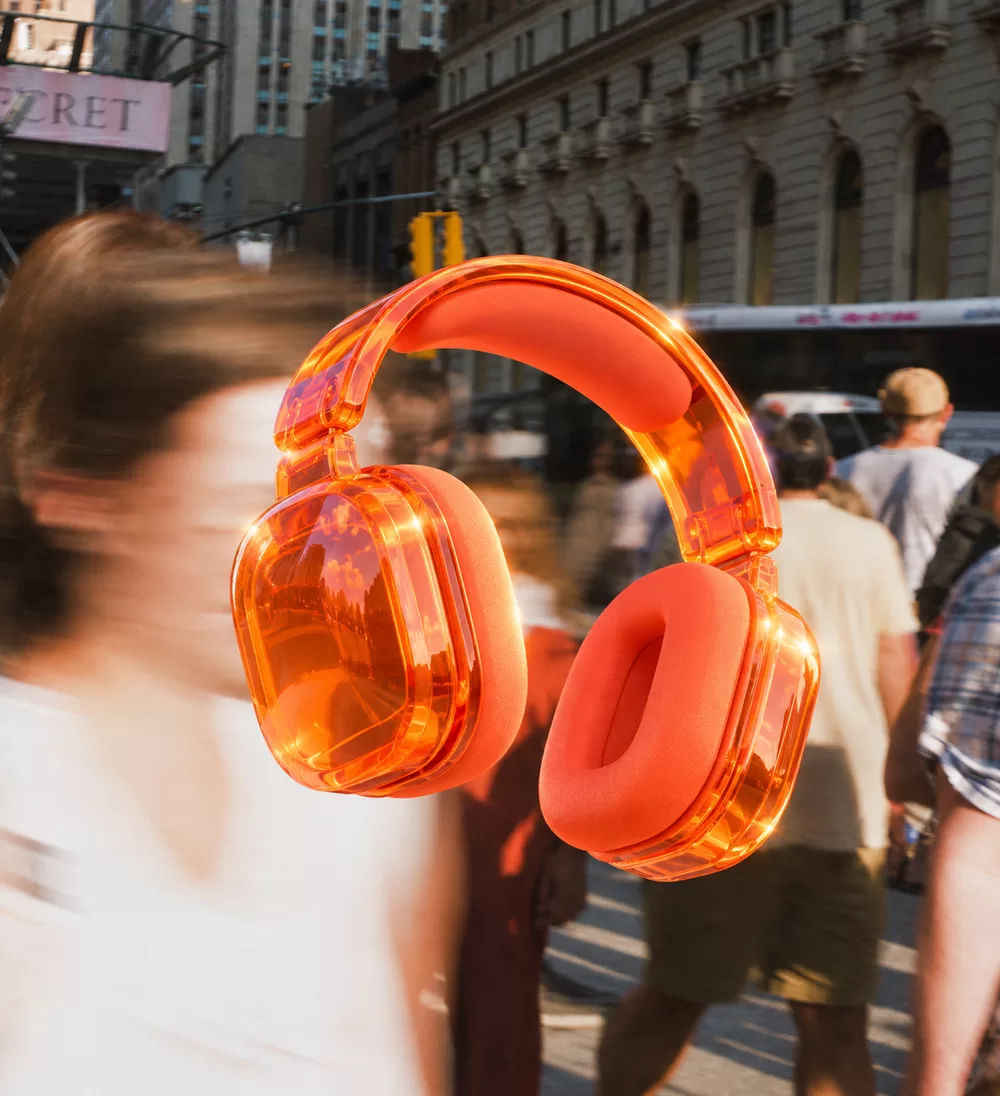 Orange headphones against a city street